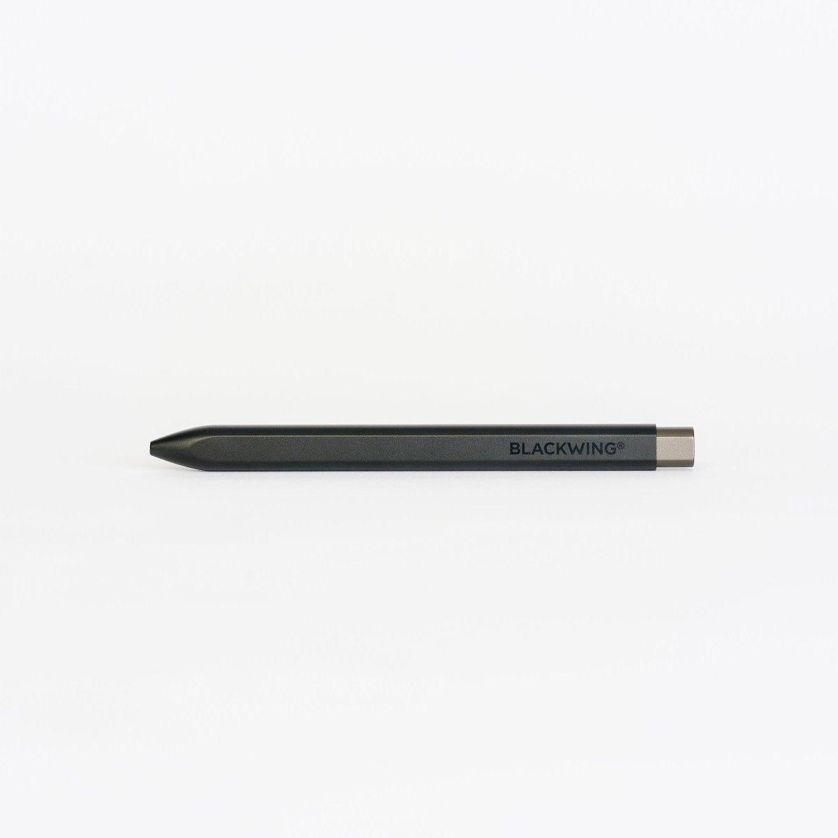 Black pen with 'BLACKWING' wordmark on barrel and a grey clicker on a white background