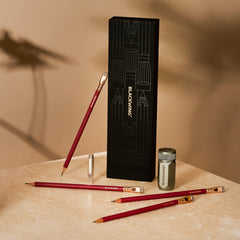 Blackwing Pencil Essentials Set with Matte Red pencils, silver one-step sharpener, and silver point guard
