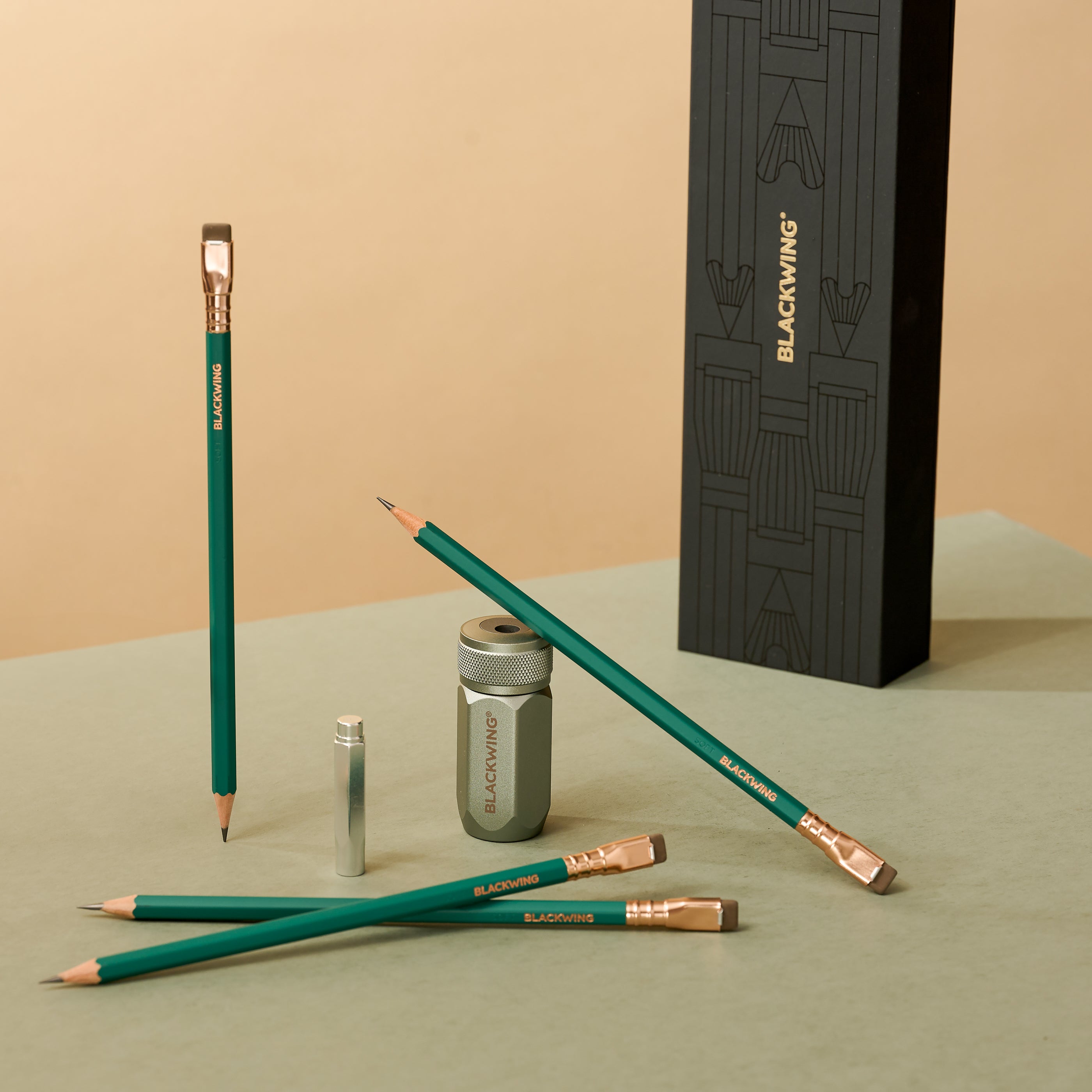 Blackwing Pencil Essentials Set with Matte Green pencils, silver one-step sharpener, and silver point guard