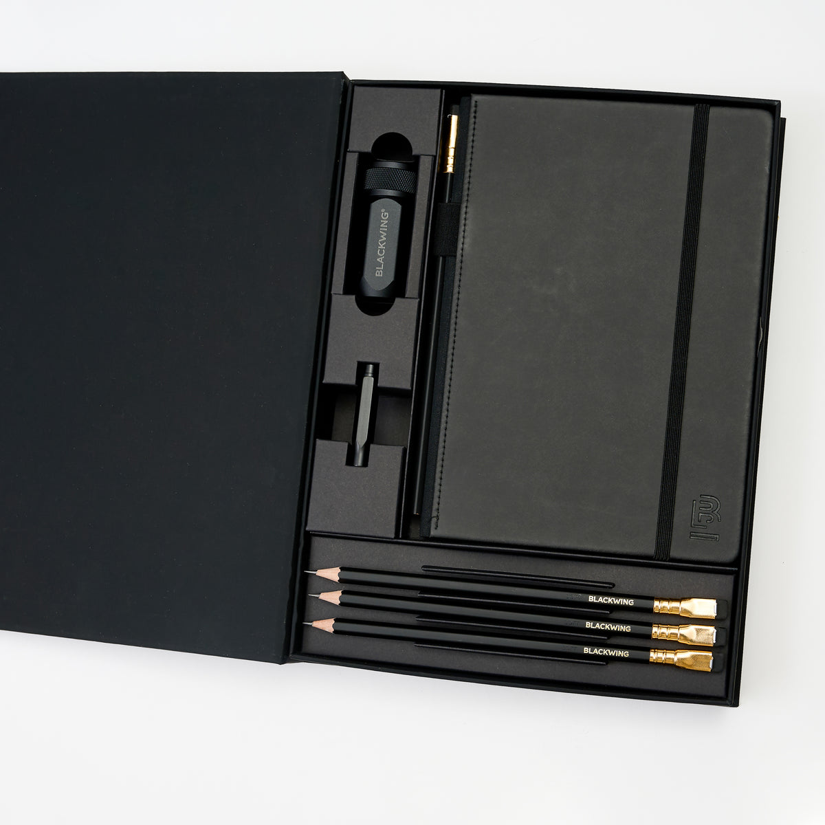 Blackwing Notebook Essentials Set with black hardcover notebook, 4x Matte pencils, black one-step sharpener, and black point guard