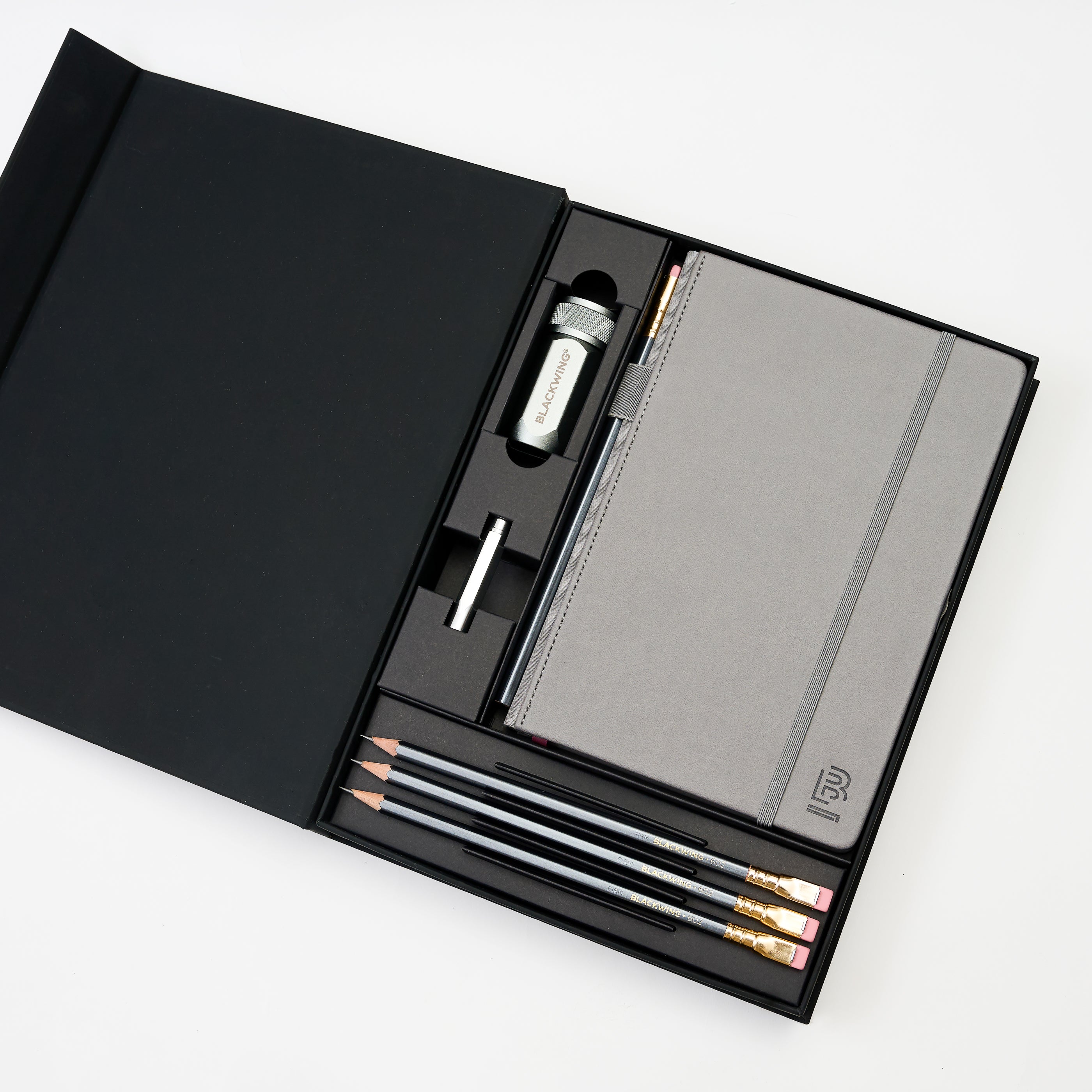 stationery gift set with grey hardcover notebook, 4x 602 pencils, silver one-step sharpener, and silver point guard