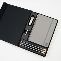 stationery gift set with grey hardcover notebook, 4x 602 pencils, silver one-step sharpener, and silver point guard