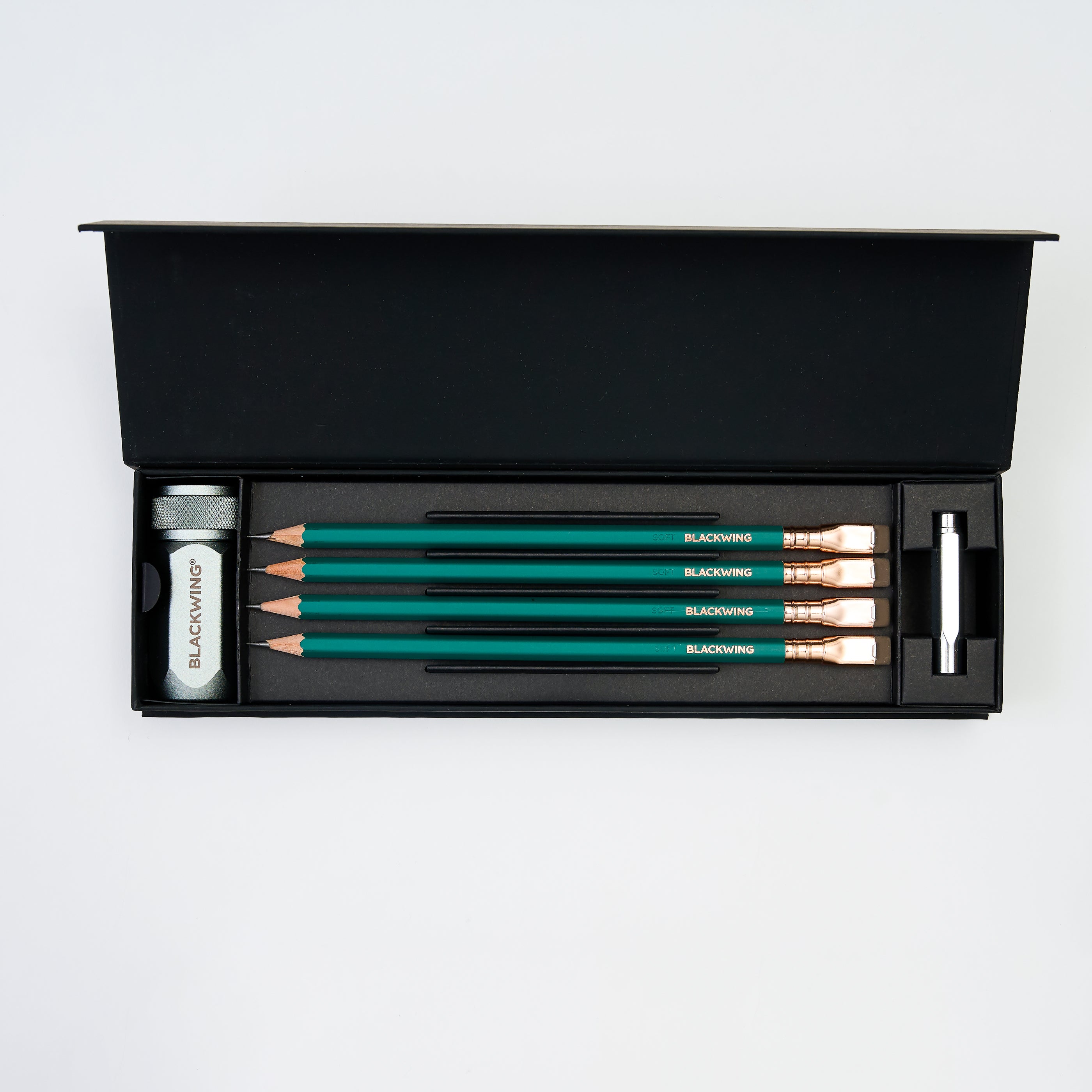 pencil set with 4 Matte Green pencils, a silver one-step sharpener, and a silver point guard all in a black gift box