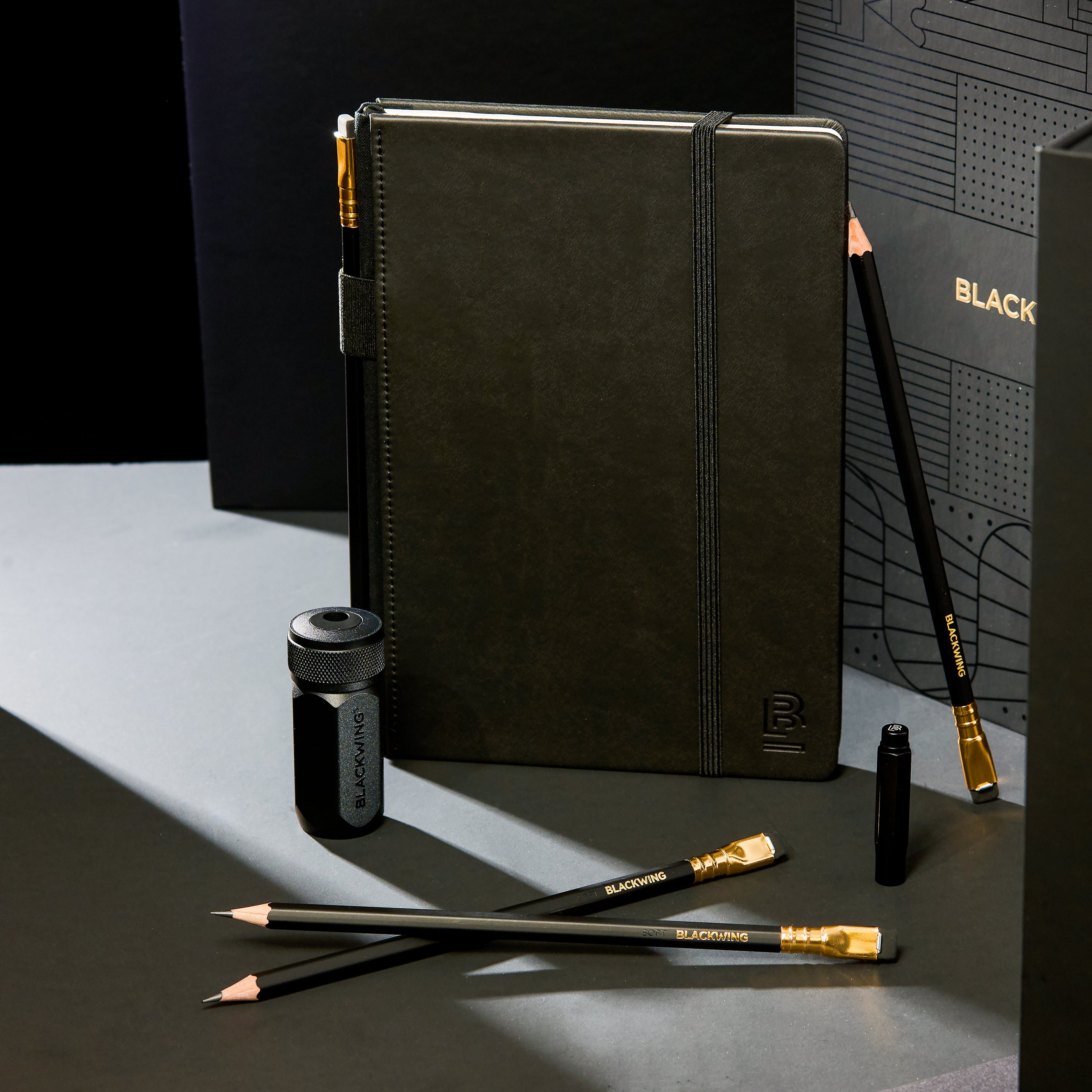 Blackwing Notebook Essentials Gift Set with black hardcover notebook, Matte pencils, black one-step sharpener, and black point guard