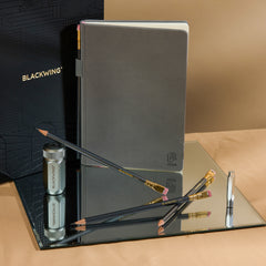 Blackwing Notebook Essentials Set with grey hardcover notebook, 602 pencils, silver one-step sharpener, and silver point guard