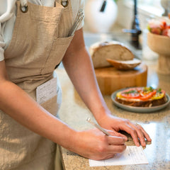 chef writing with a Blackwing Volume 140 pencil