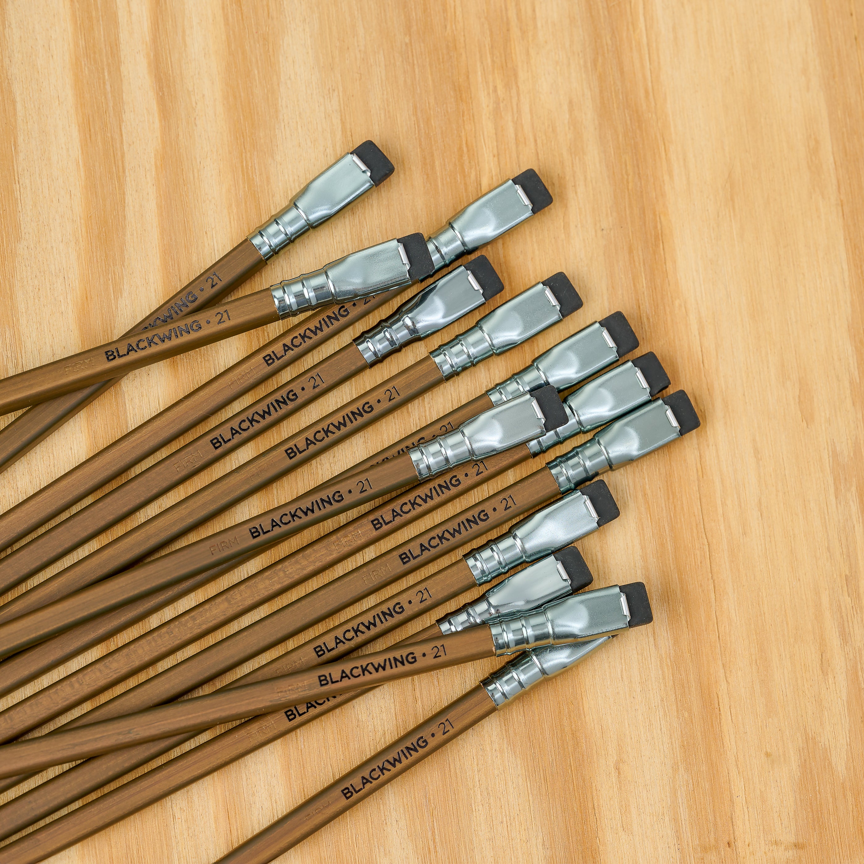 Volume 21 Blackwing pencils, featuring a square walnut-stained barrel, black imprint, silver ferrule, and black eraser