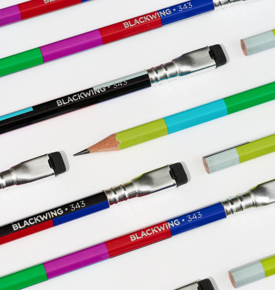 Colorful Blackwing pencils with 'Blackwing 343' imprinted in silver arranged on a white surface