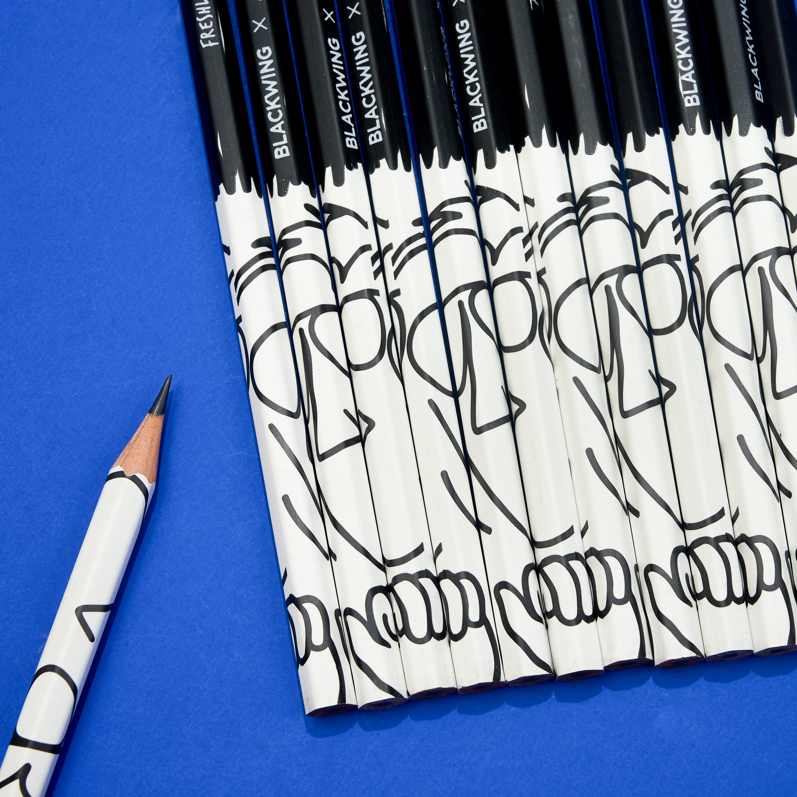Blackwing pencils with "Freshly Squeezed" Orange Cassidy design on a blue background