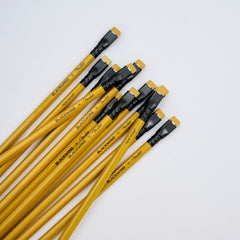 A set of yellow wood pencils with black ferrules and yellow erasers, arranged diagonally on a clean white background. The pencil barrels feature black text reading 'BLACKWING x Fender' and 'TELECASTER'.