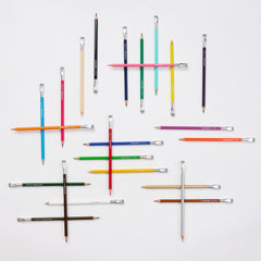 erasable colored pencils arranged on a white background