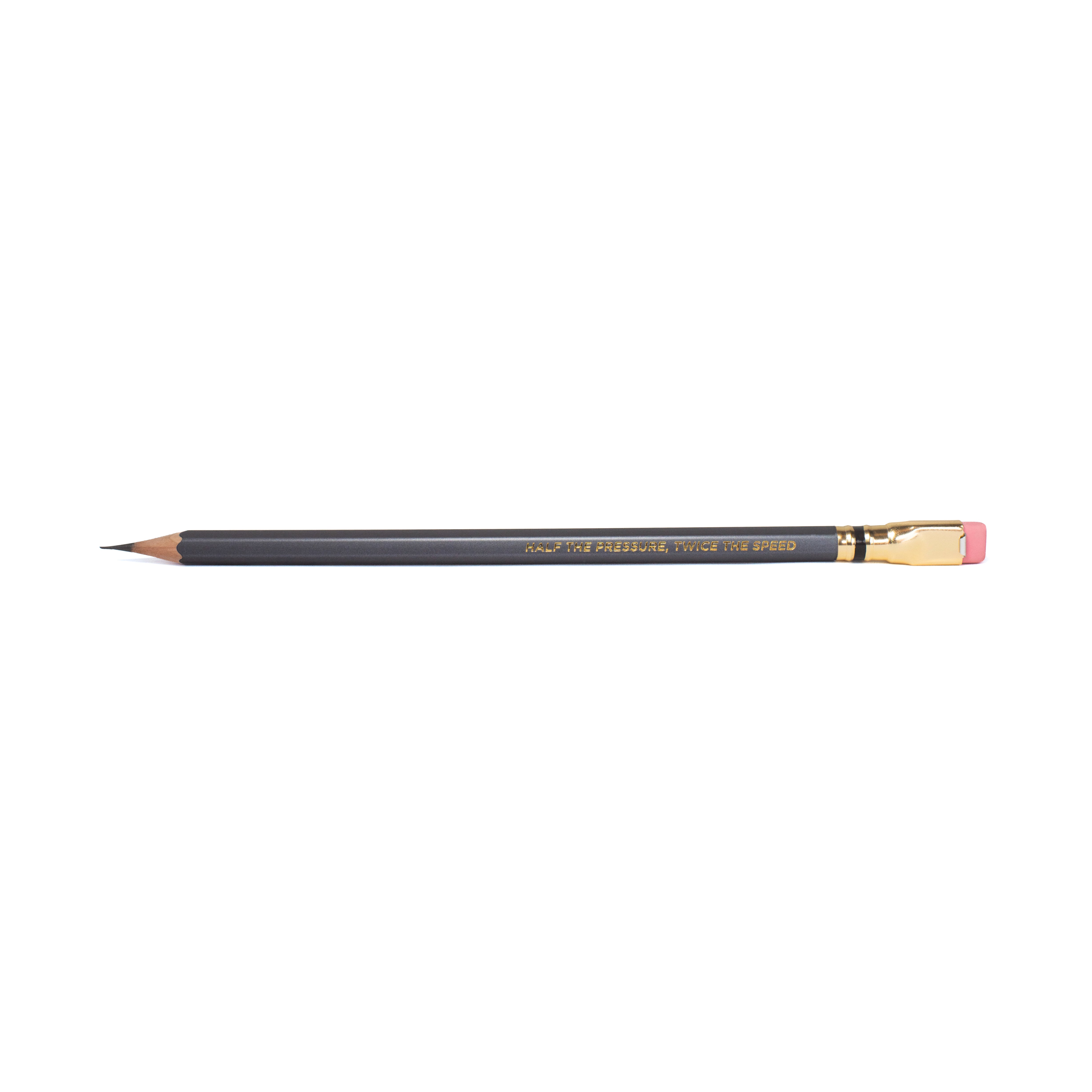 A dark gray wooden pencil with gold lettering and a pink eraser, shown horizontally on a plain white background. Imprint says "HALF THE PRESSURE, TWICE THE SPEED"