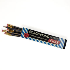 A pack of 12 Blackwing Eras pencils with dark grey barrels and pink erasers, shown in their blue and white striped packaging on a clean white background.