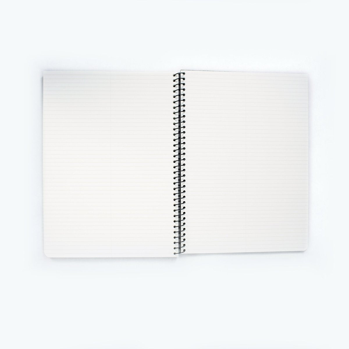 Blackwing A4 Spiral Notebook with ruled pages laying open on a white background