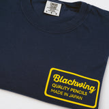 Navy blue 100% cotton t-shirt with yellow "Blackwing, Quality Pencils Made in Japan" text print on left chest