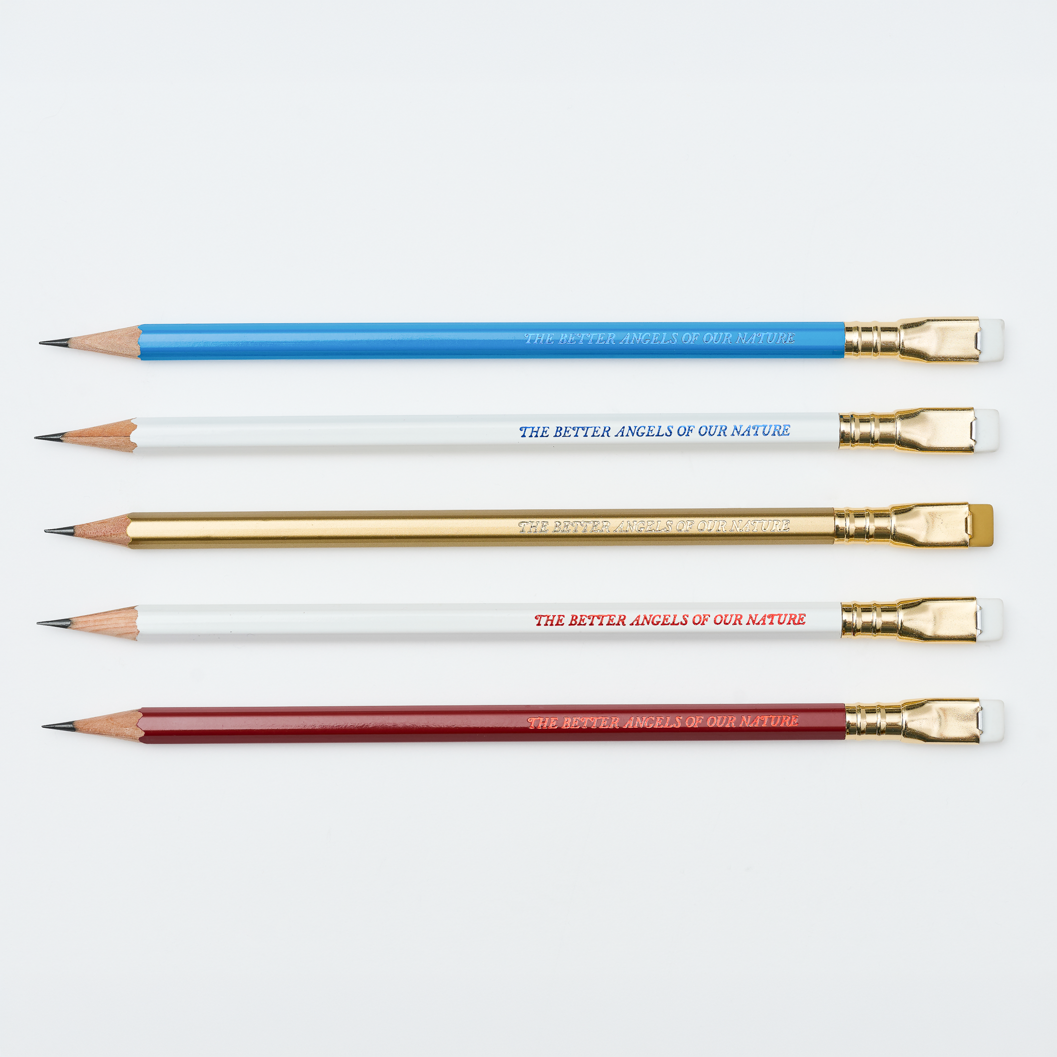 Blackwing pencils in red, white, blue, and gold, each with imprint 'THE BETTER ANGELS OF OUR NATURE' on a white background