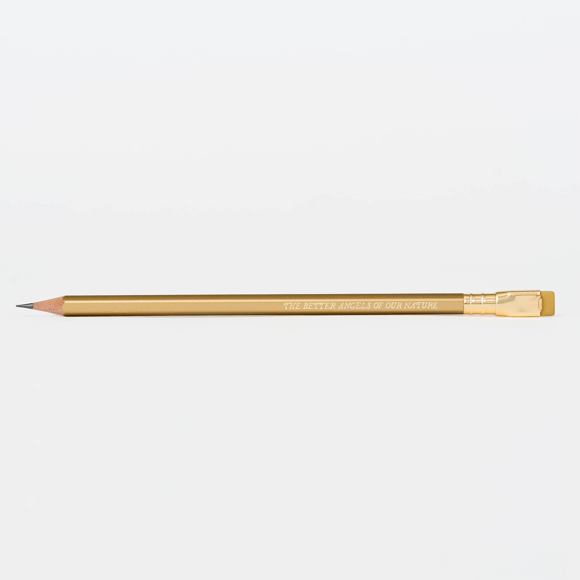 gold pencil with imprint 'THE BETTER ANGELS OF OUR NATURE' on a white background