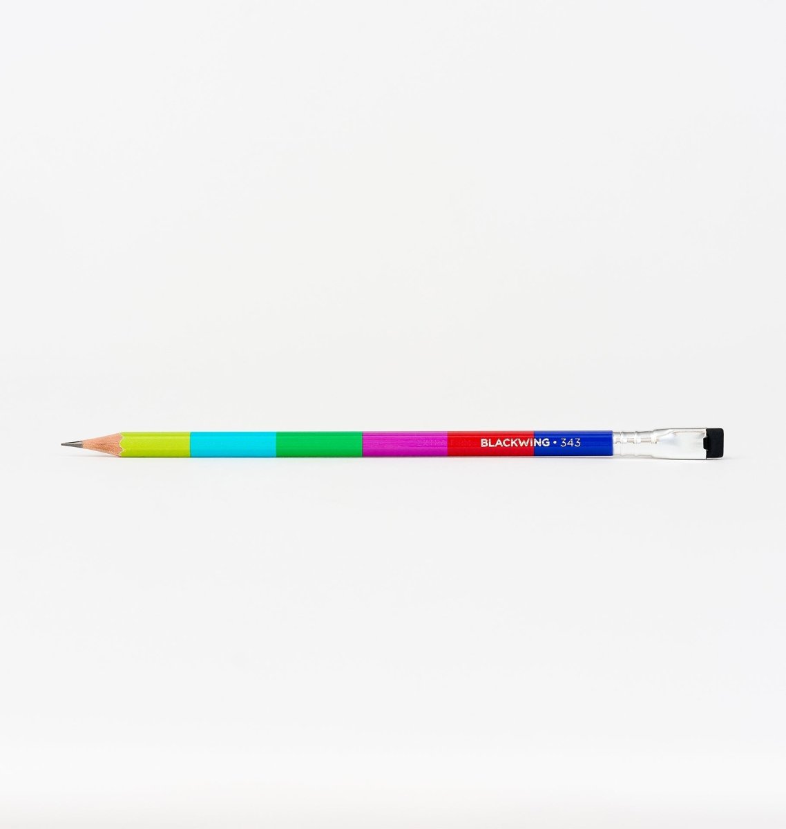 Blackwing Volume 343 pencil, featuring lime green, blue, green, dark pink, red, and blue colorblocking, inspired by the NTSC test pattern and broadcast television. The pencil also has a silver ferrule and black eraser. Laying on a white background.