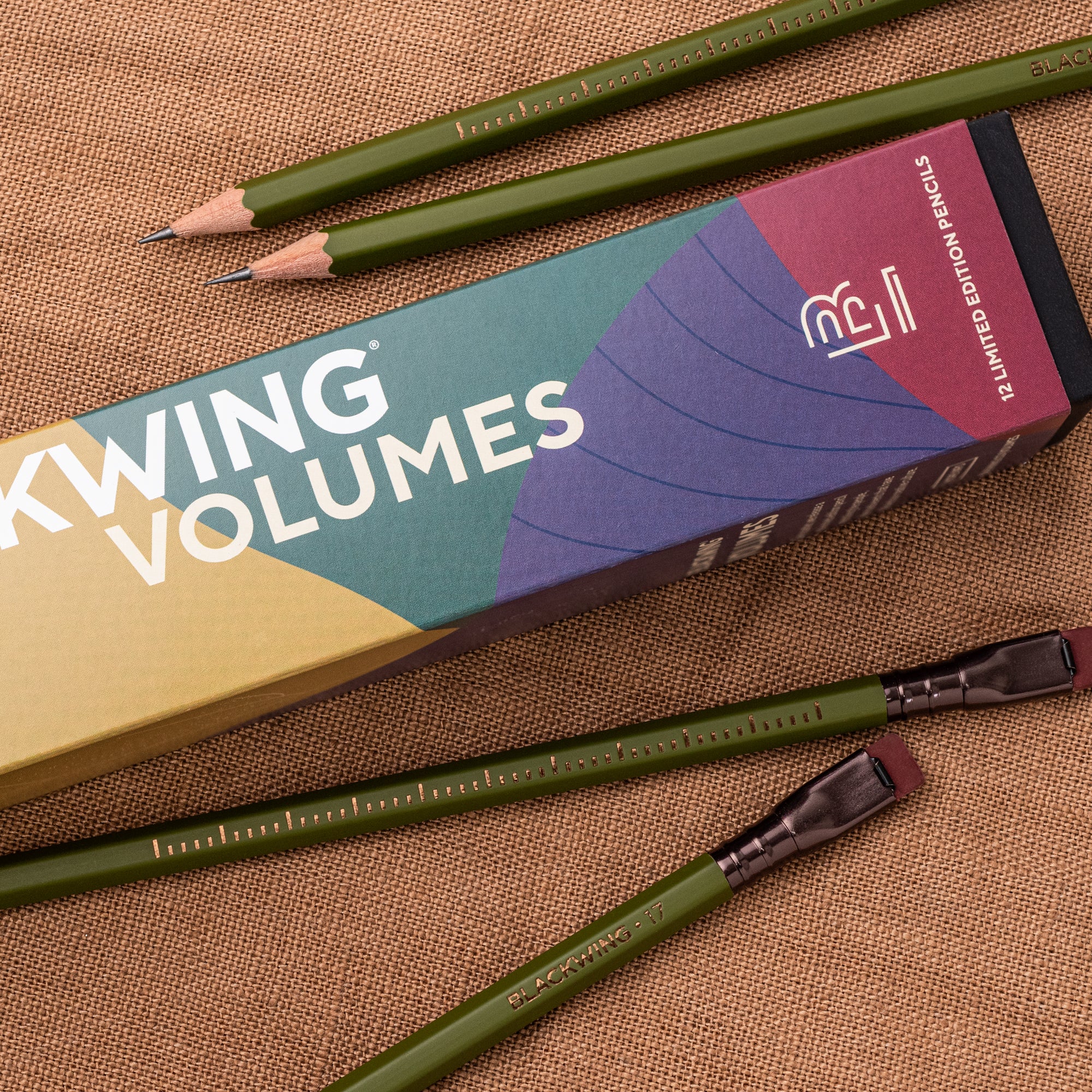 A Blackwing Volume 17 (Set of 12) next to a box of gardening pencils.