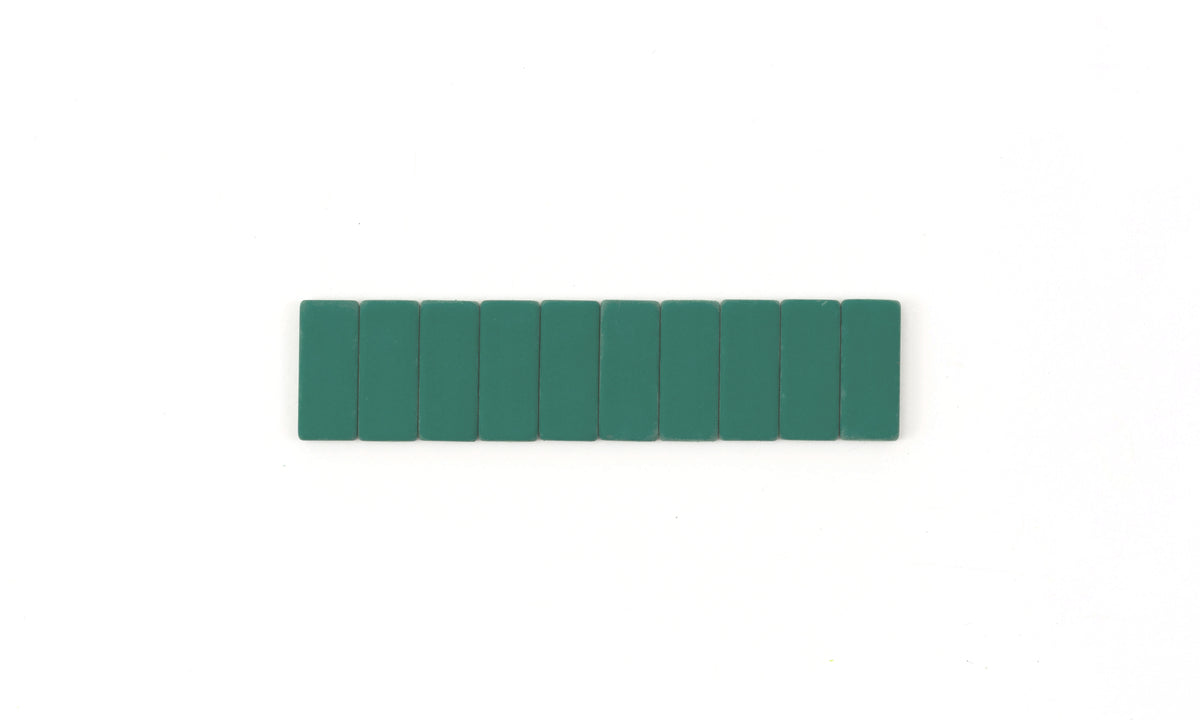 A row of Volume 710 Replacement Erasers aligned upright on a white background, captured with the distinct aesthetic of visual arts.