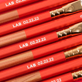 A row of Blackwing Lab 02.22.22 pencils with the word Lab 02.22.22 on them.