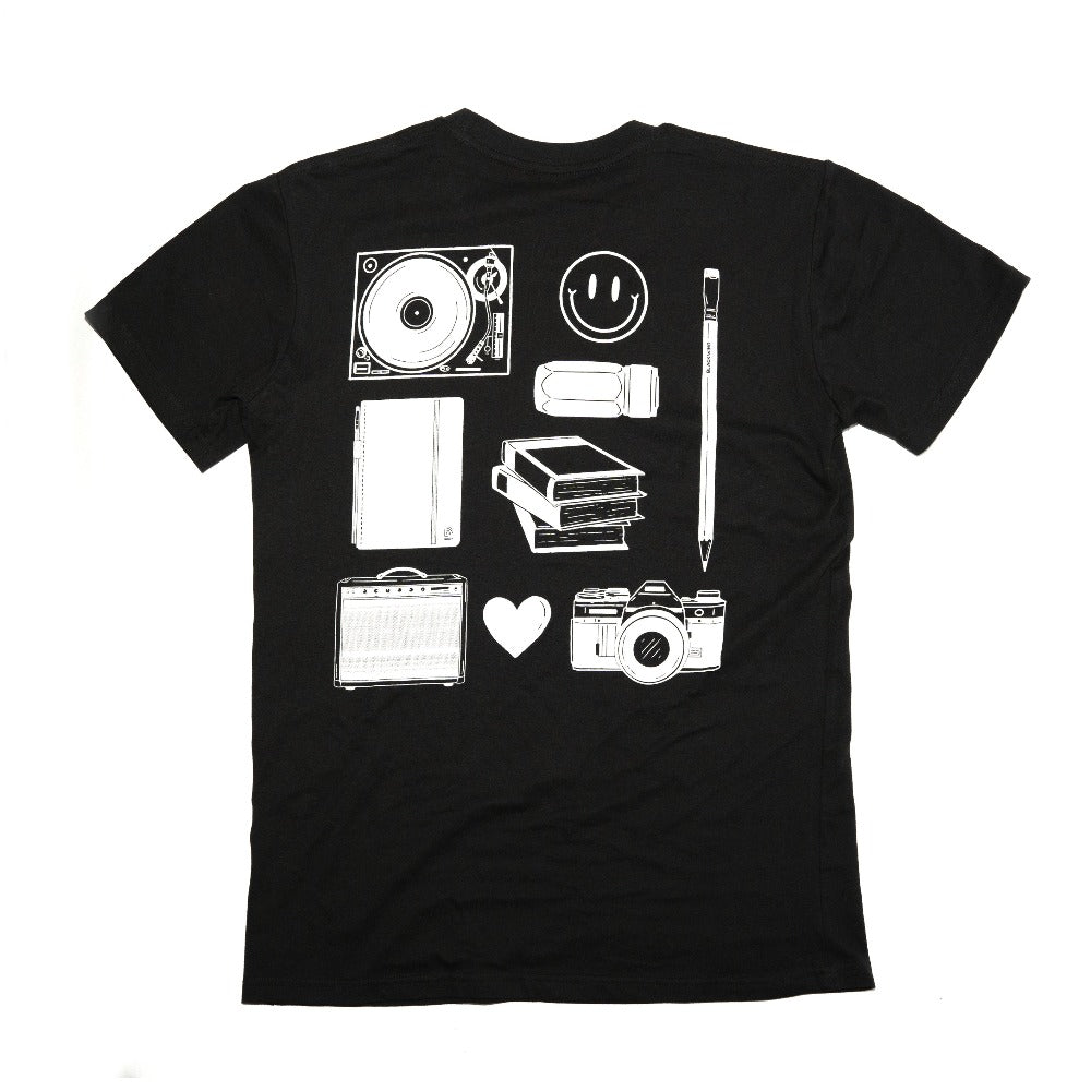 Blackwing Doodle Shirt in Black - Back of shirt with white screen-printed graphics (record player, smiley face, camera, speaker, heart, books, eraser, pencil, and notebook)