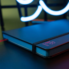 Blackwing Volume 6 Medium Slate Notebook in black with red "B" emblem and red placeholder ribbon